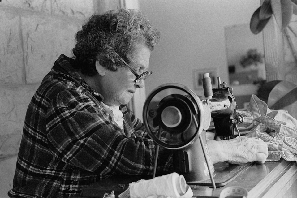 Woman working on a sewing machine