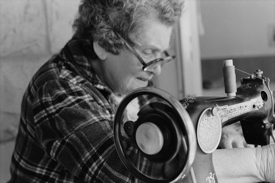 Close-up of a woman working on a sewing machine