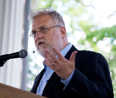 Professor Yehudah Mirsky speaking at a podium