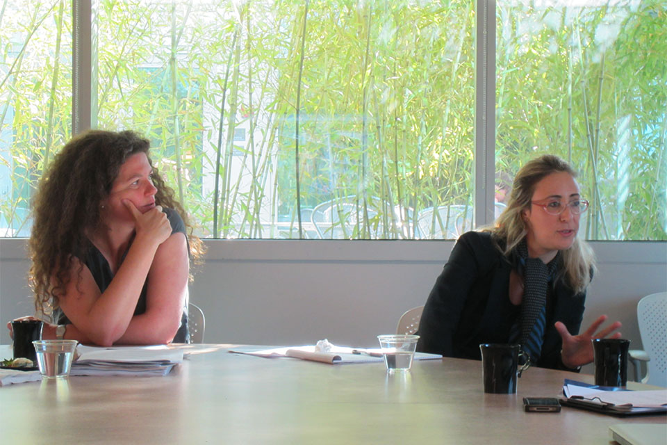 Ilana Szobel in a seminar room with bamboo growing outside, at a workshop