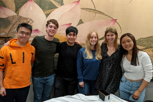 Photo of Davis scholars posing at a table