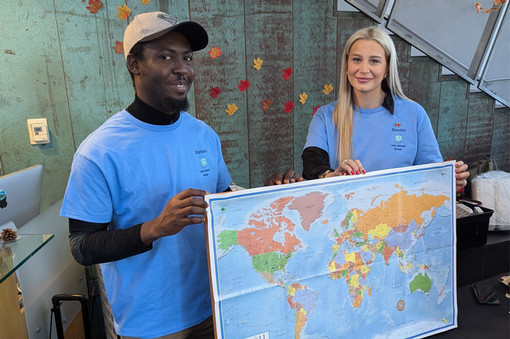 2024 Global Fellows holding a map