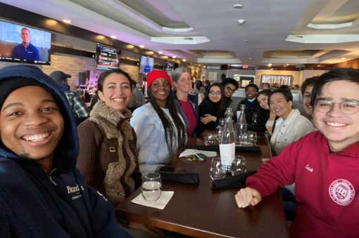 Wien scholars enjoying a meal together