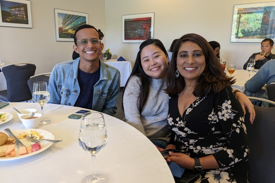 Three Fulbrighters sitting at a table