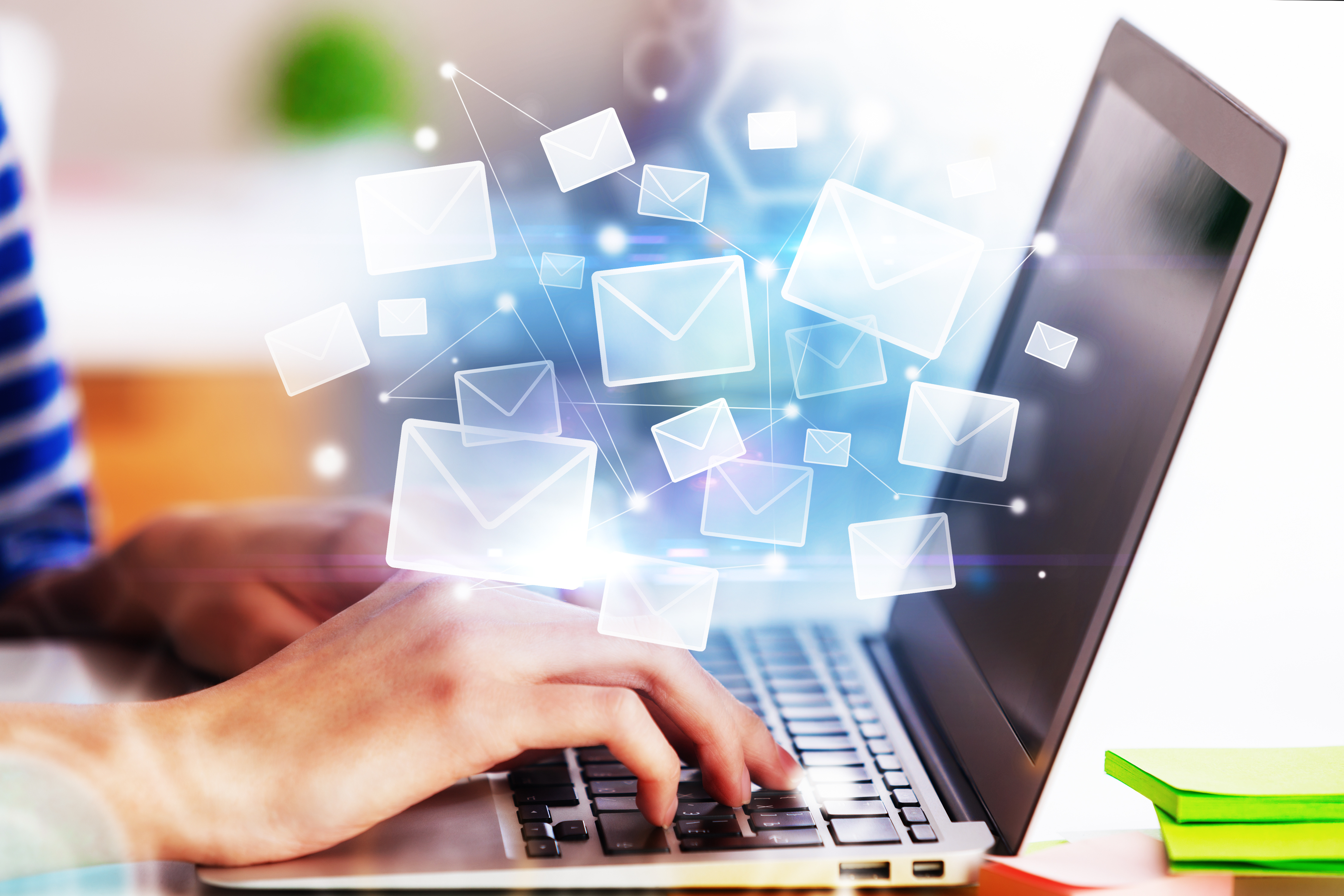 laptop with envelopes coming out