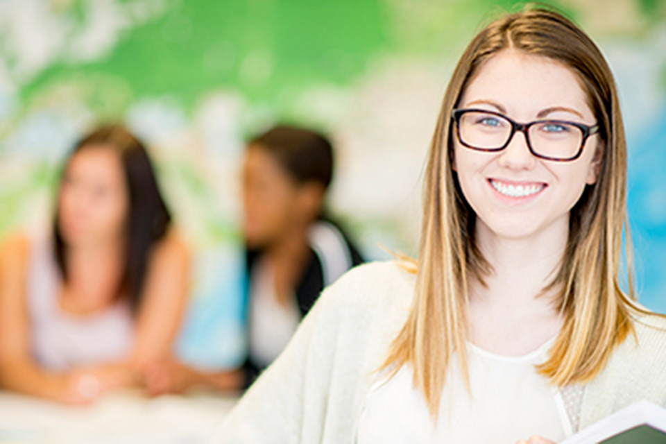 smiling female student wearing glasses