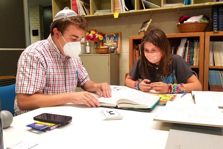 Rabbi Rosen teaching a student