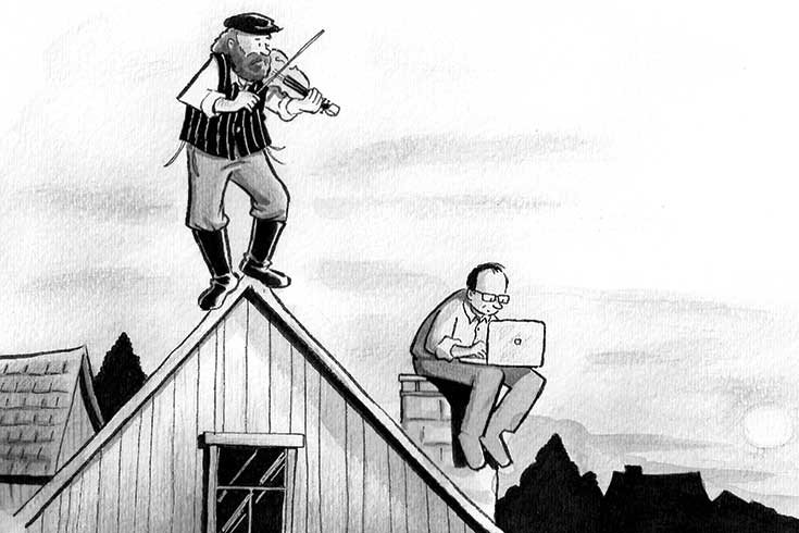 A man dressed in 20th-century clothes fiddles on the roof while a modern-dressed man sits with his laptop