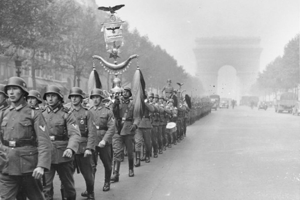 German soldiers parade on the Champs Élysées in Paris in June 1940.