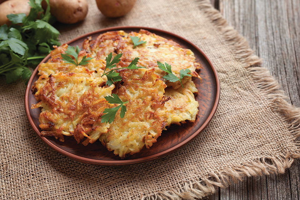 A plate full of potato pancakes (latkes)