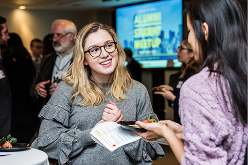 A young Brandeis alumna at a campus event