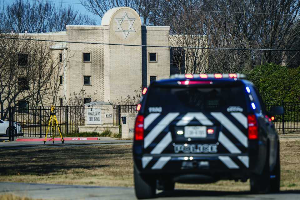 Police cruiser in front of synagogue