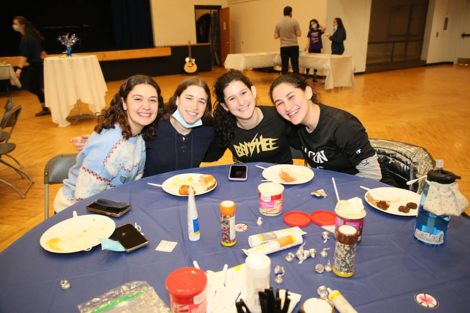 A group of students smiling and posing