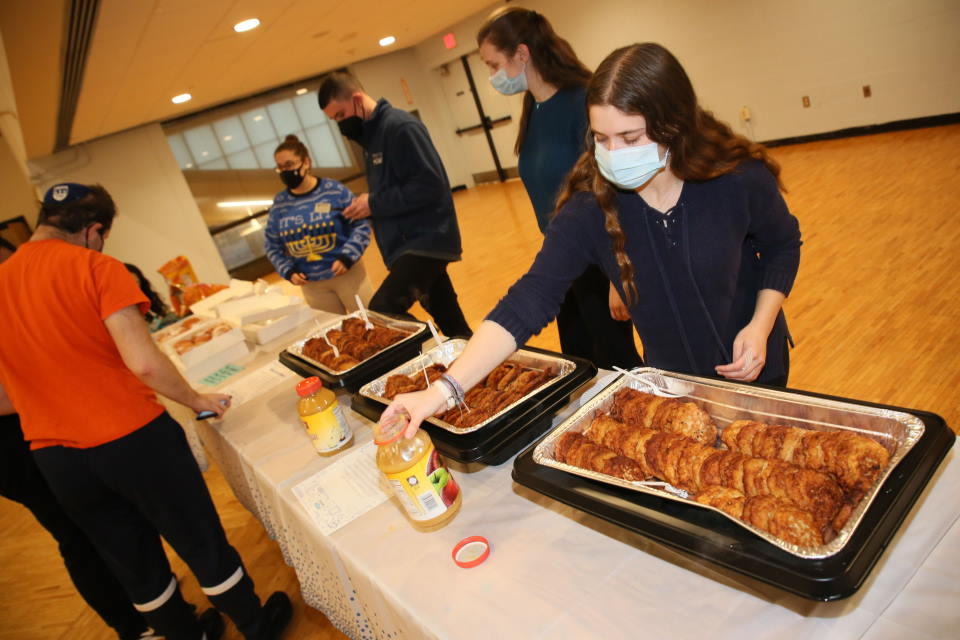 Students looking at latkes