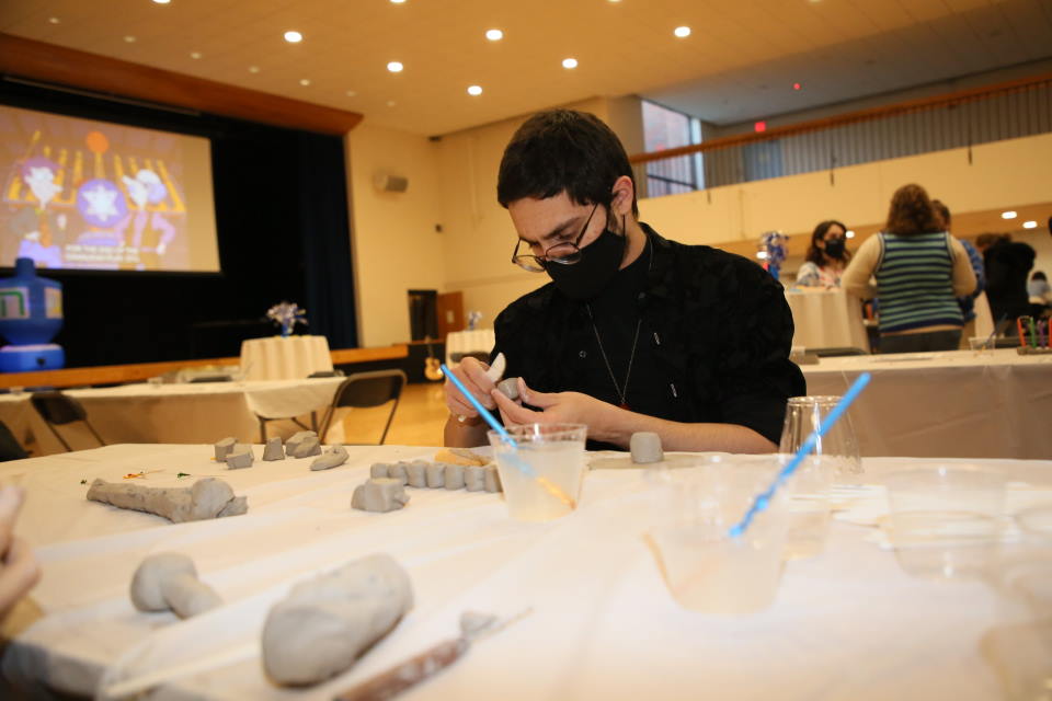 Students makes clay dreidel