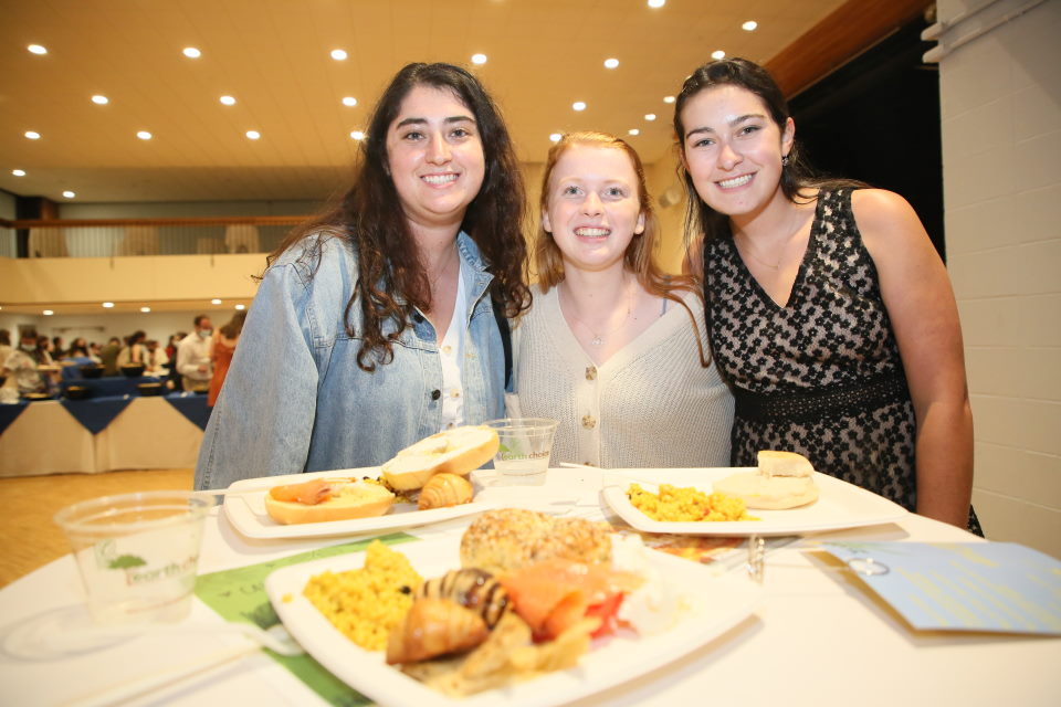 Students posing while eating