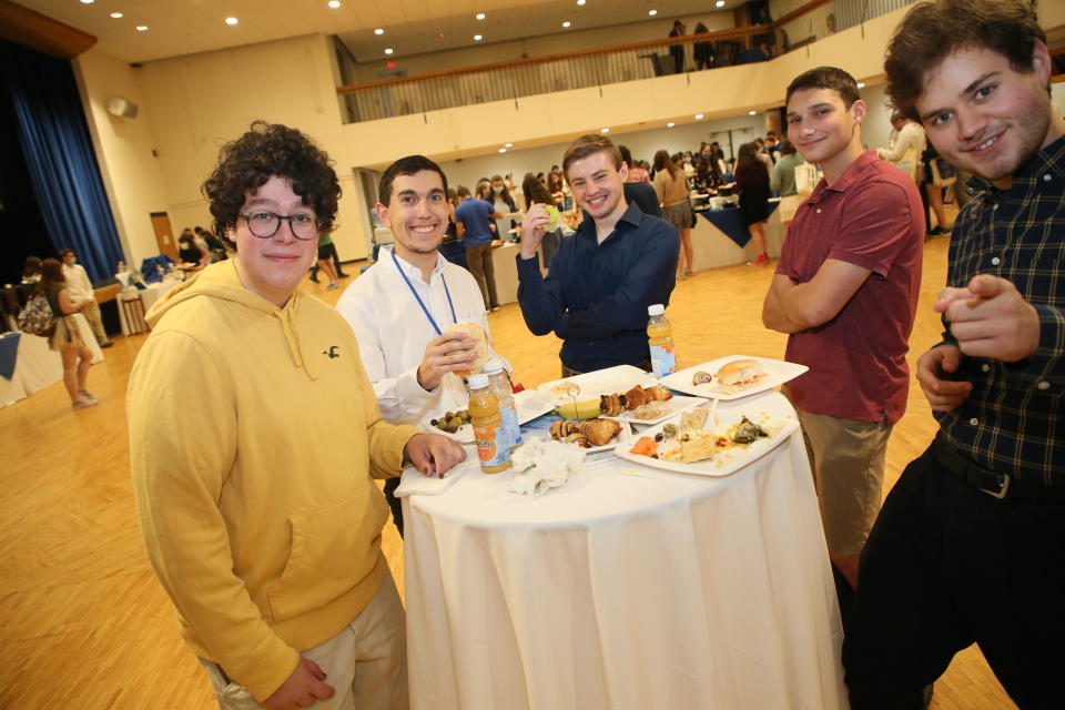 Students around a table eating