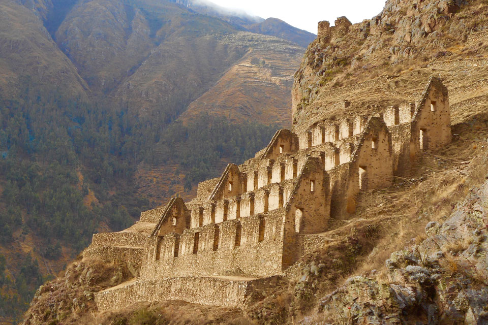 Rocky ruins of buildings on a mountainside.