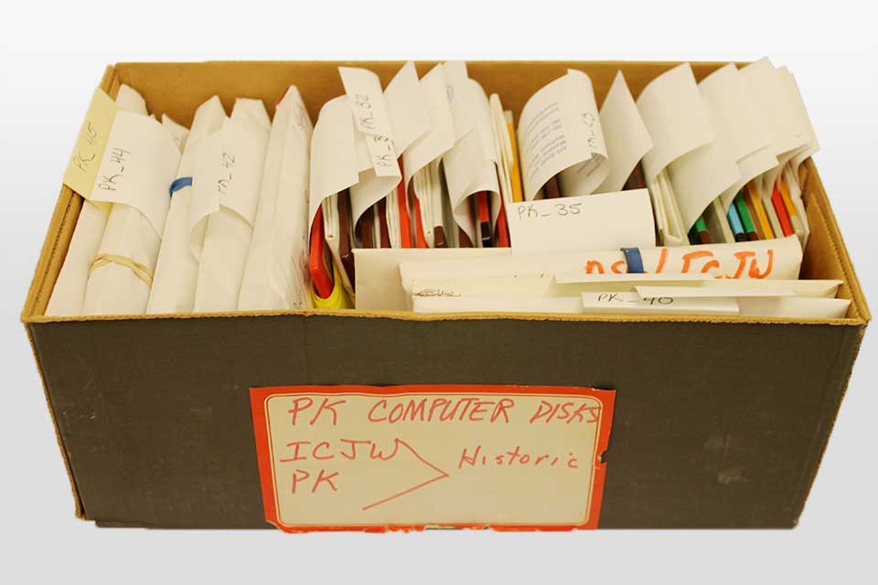 Project Kesher floppy disks in a box with various paper labels