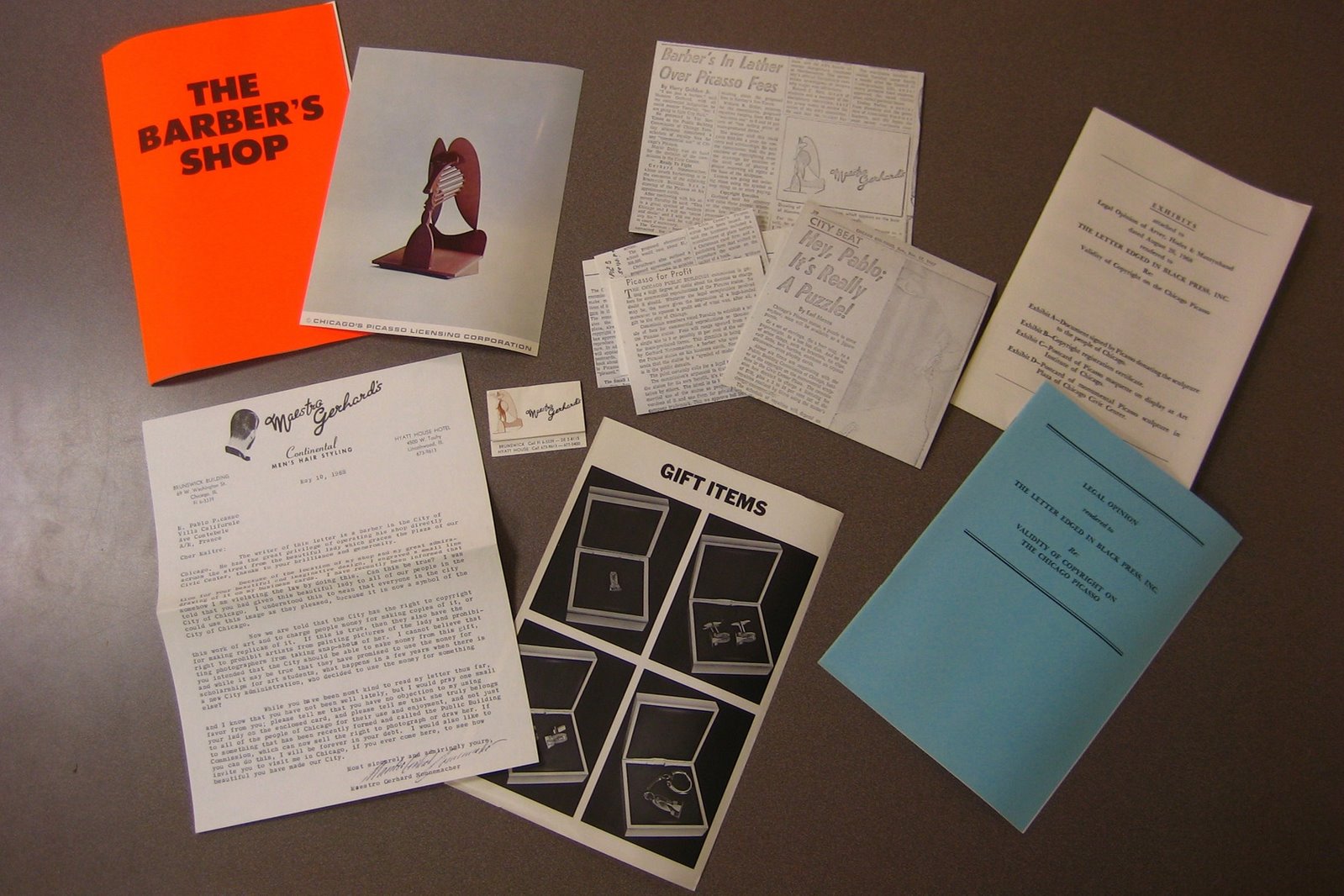 Photograph of correspondence that William N. Copley selected for his serial-box surrealist publication "S.M.S. (Shit Must Stop)." Many of the documents are related to a Pablo Picasso copyright suit.