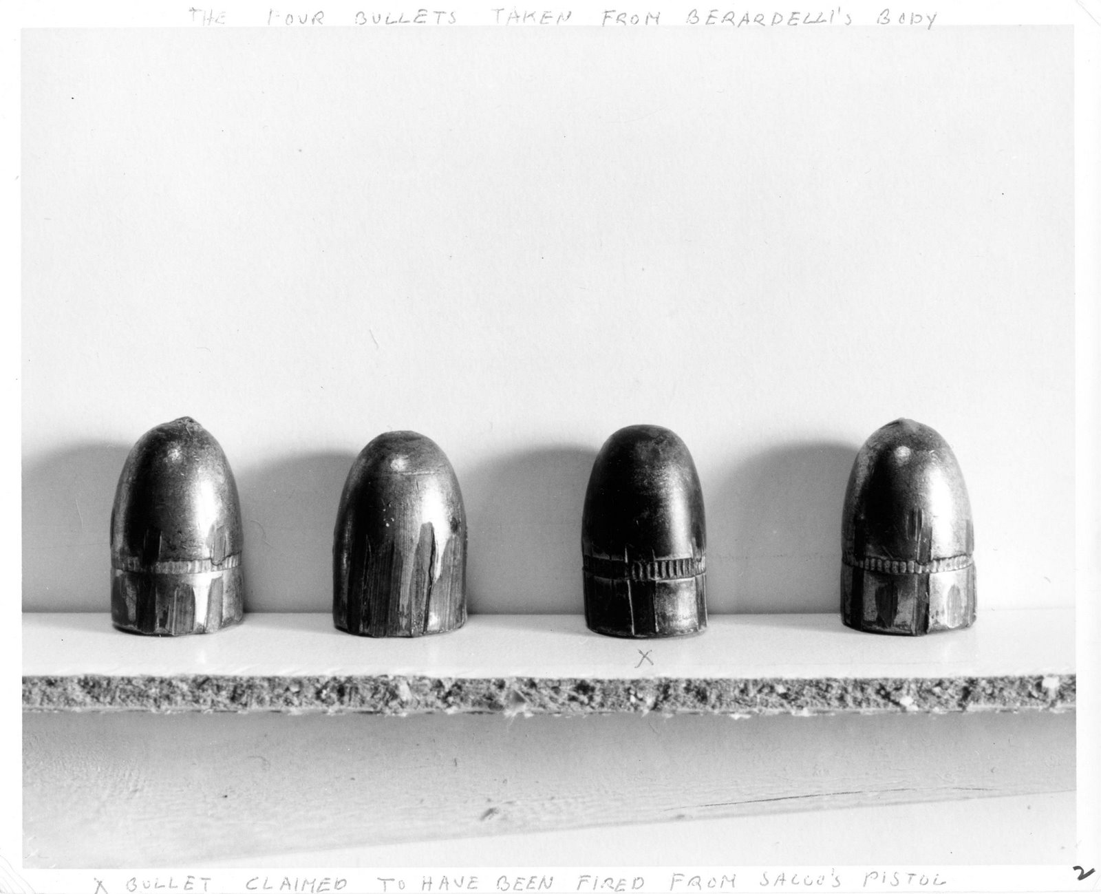 Black and white photograph of the four bullets taken from Berardelli's body