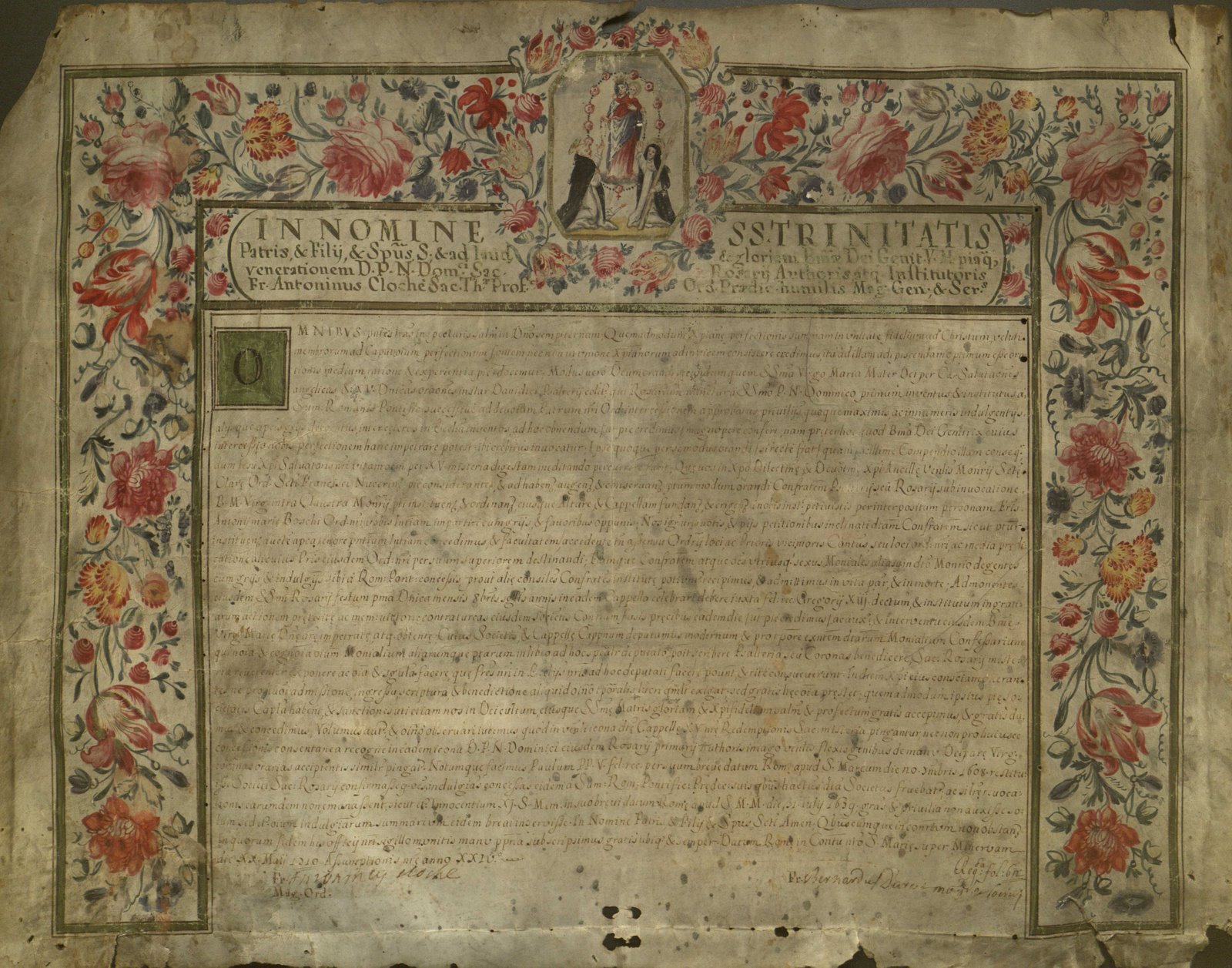 A worn-down page with Latin writing, featuring an illustrated border of roses