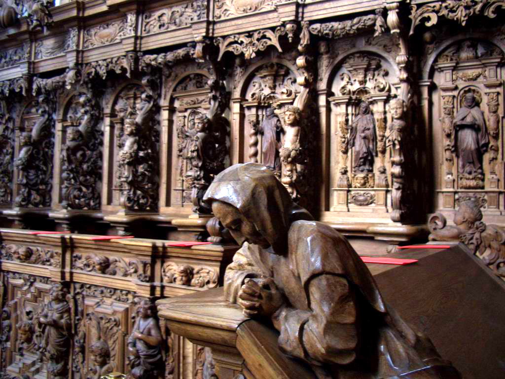 Buxheim Monastery Choir stalls with a wooden sculpture of a hooded person praying