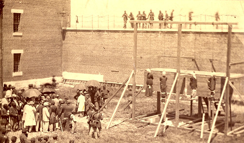 Photograph of four Lincoln assassination conspirators after being publicly hanged at Washington D.C. Ft. McNair.