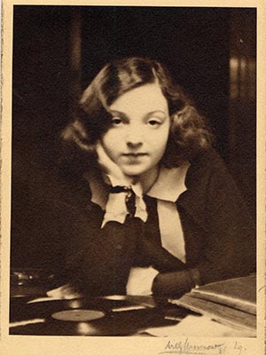 Closeup photo of a woman with head resting on hand