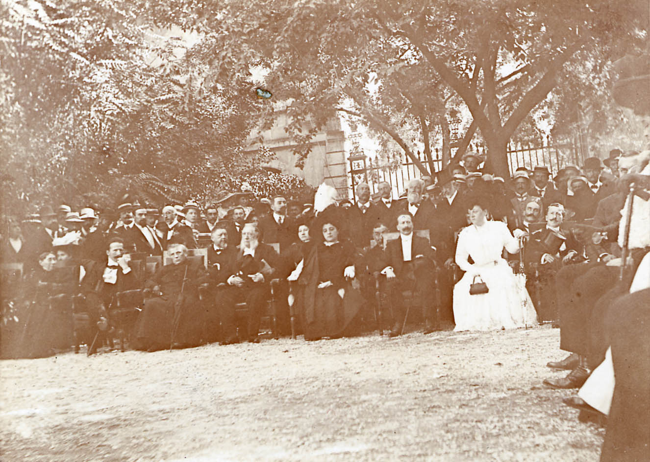 A gathering of notables -- sepia photograph with large group  of people