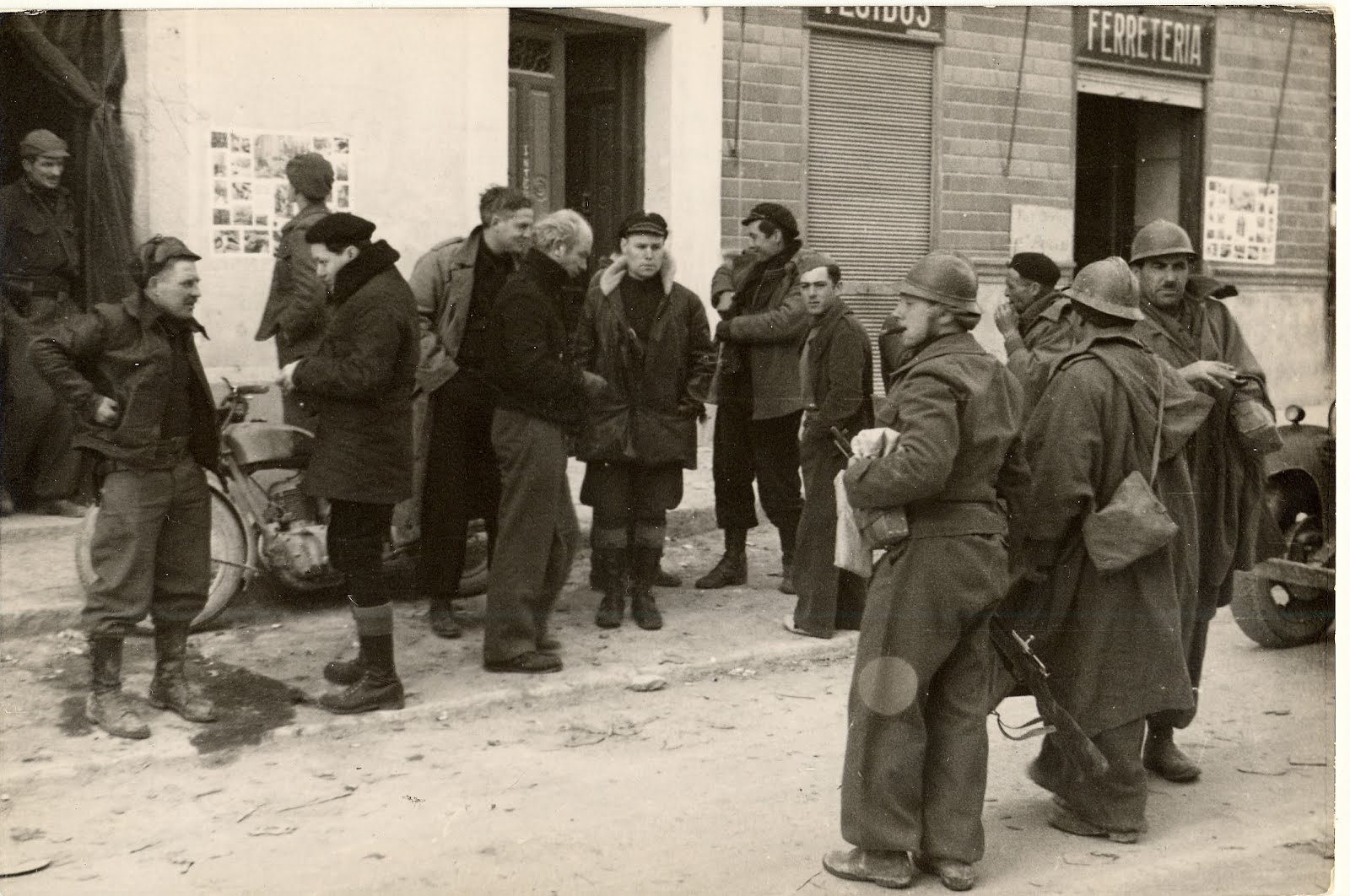 photograph from Spain, men on the street with soldiers