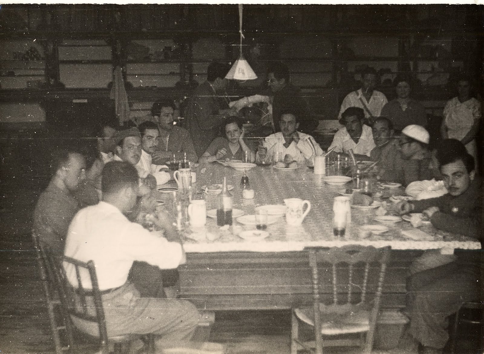korvin photograph of various persons sitting around a table