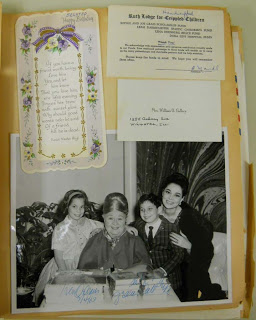 scrapbook page with greeting cards, a large black and white photo of Sophie Tucker posing with a woman and children, and correspondence