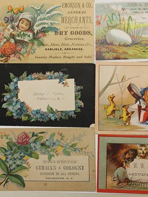 Trade cards featuring floral designs and animals