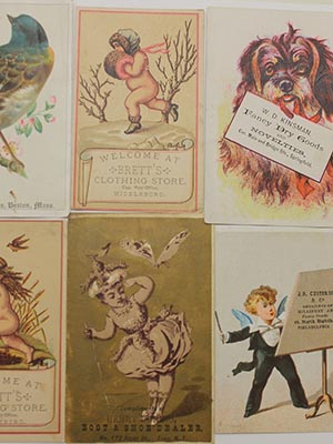 Eight trade cards featuring children and animals, arranged in 2 rows of 4 cards