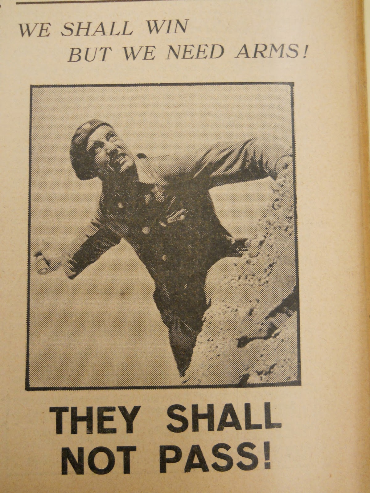 Cover of a pamphlet featuring a photo of a man about to throw a grenade, Text: We shall win but we need arms! They shall not pass!
