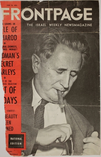 Goldmann smoking a cigar on the cover of Frontpage magazine