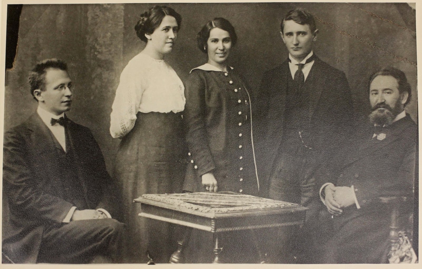 Black and white photograph of Nahum Goldmann with two women and two men.
