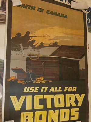 "Use it All for Victory Bonds" Canadian poster with picture of chests of gold and soldiers in distance