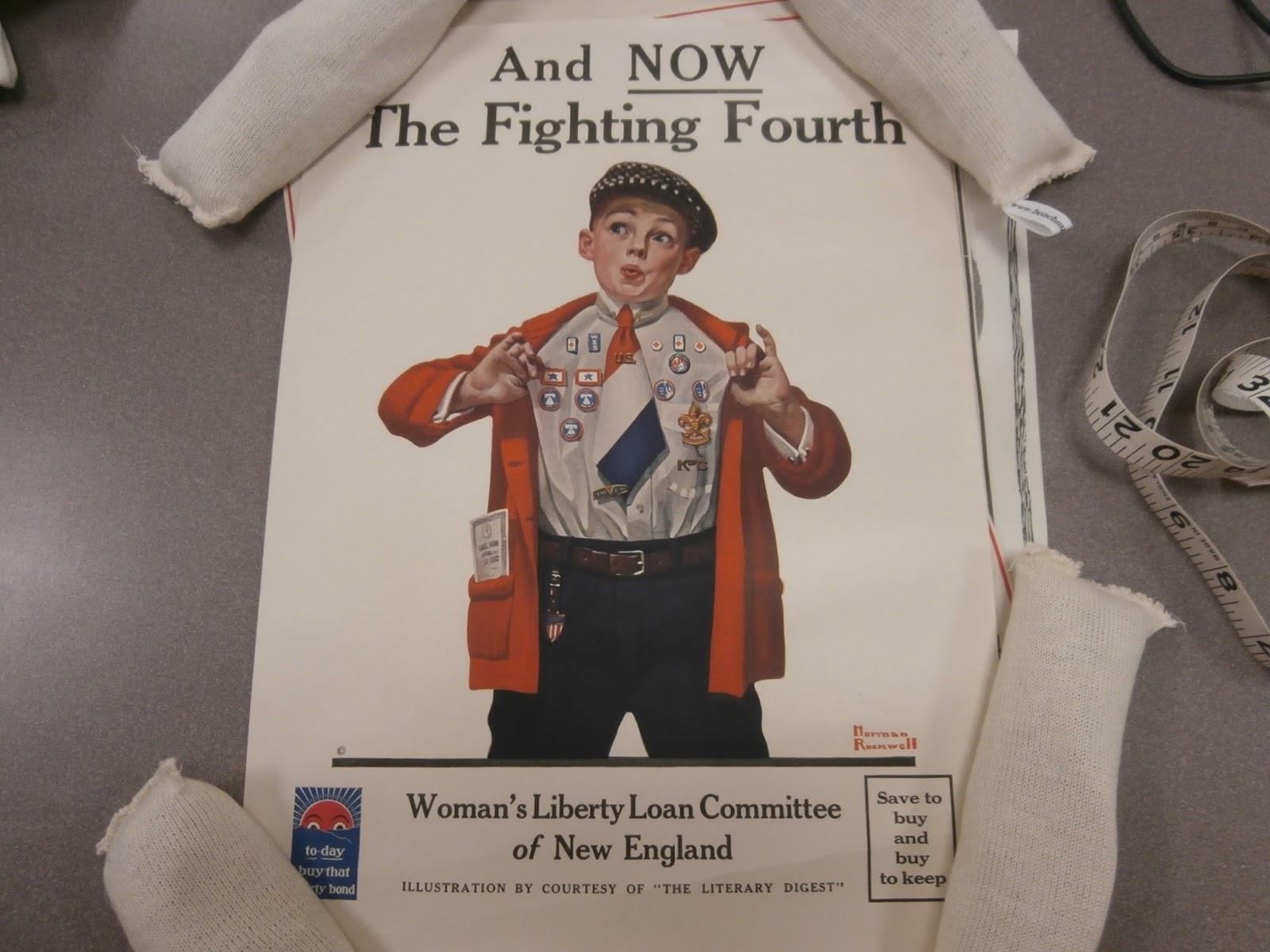 Poster by the Woman's Liberty Loan Committee of New England with illustration of young boy with numerous badges on his shirt that reads: And NOW The Fighting Fourth.