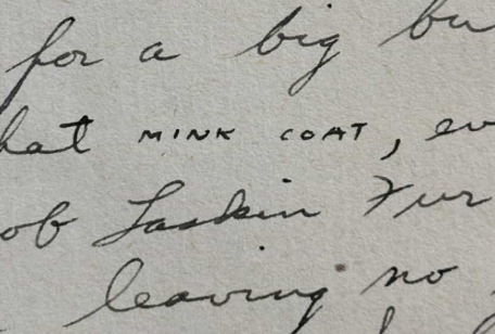 A section of a handwritten letter, with the words "mink coat" printed in capitals amongst other cursive writing.