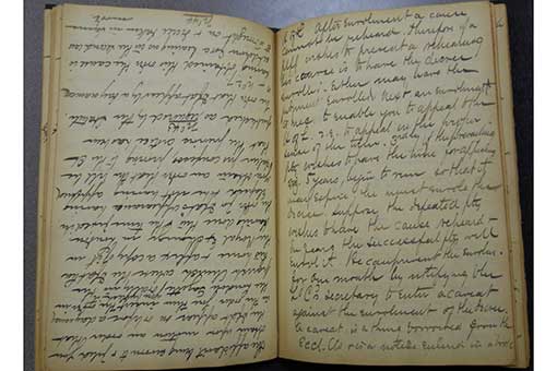 A handwritten essay in a notebook