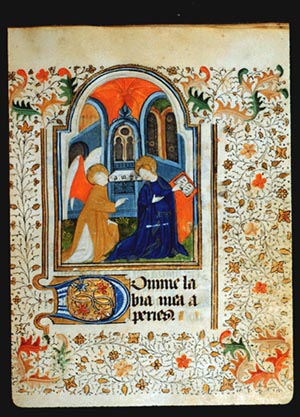 Painting on page 20r of The Annunciation. A winged angel speaking to Mary in a blue robe holding a book, with archways behind them.  The margins around the painting are filled with a painted border of achantus scrolls in red and blue, and leaf and vine patterns The leaves in the four corners are larger than the others.