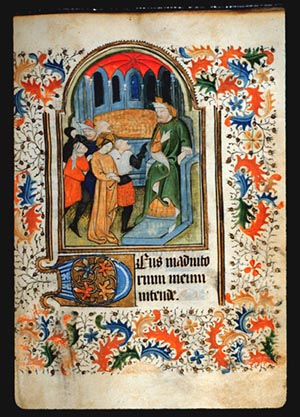 Page 42r containing a painting of Christ before Caiphus. In the painting, a seated man faces a crowd of 8 people who are talking to him. A man with a black glove points at him. The central person in the crowd has a halo. Around the painting the page is filled with ornate leaf and vine patterning. 