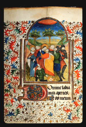Painting on page 39v of The Kiss of Judas (Betrayal in Gethsemane). There is a group of 7 people in the foreground, and trees in the background with an orange sun up above with rays of light. The margins around the painting are filled with a painted border of achantus scrolls in red and blue, and leaf and vine patterns. 