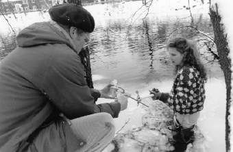 Attila Klein, Professor of Biology, and student taking sample on the Charles River 1993