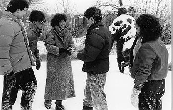 Six students frolicking in the snow. January 16, 1984