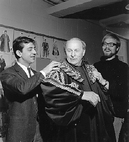 Actor Morris Carnovsky Trying on Costume. Two men assist.