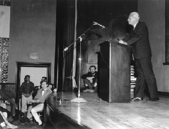 A speaker at the podium addresses the audience . Professor Herbert Marcuse Lecture Professor of Politics, 1954-1965 May 6, 1967