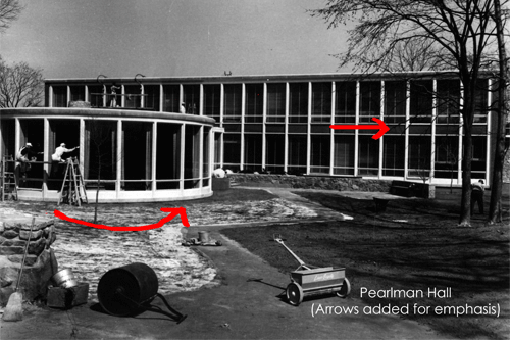 Photograph of Pearlman Hall with red arrows for emphasis